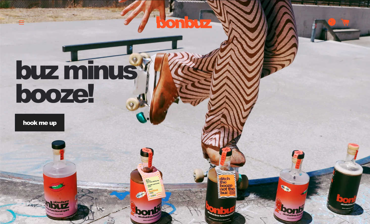 Background hero image of someone roller skating in orange and brown, wavey patterned, trousers. Bonbuz drinks bottles on floor in front of rollerskater. Large text on right hand side 'buz minu booze!'; clearly a non-alcoholic drinks ecommerce brand.